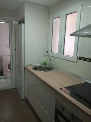 Una cocina o zona de cocina en PLAZA AYUNTAMIENTO 3 HaBITACIONES B&A