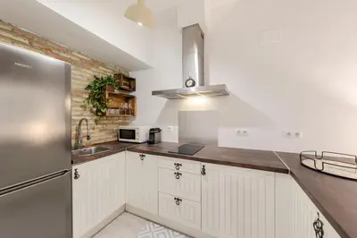 Una cocina o zona de cocina en Casas de Sevilla - Casa Descalzos