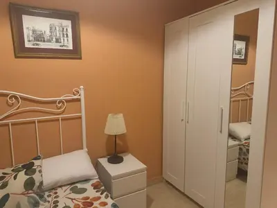 Cama o camas de una habitación en AMPLIA Y CÉNTRICA VIVIENDA PARA 6px !SEVILLA A TUS PIES!