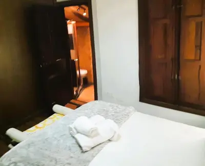 Cama o camas de una habitación en Casa rural con barbacoa y piscina