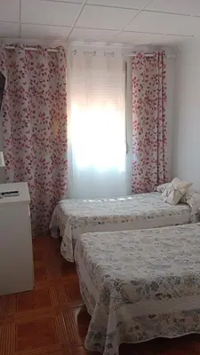 Cama o camas de una habitación en Hostal de la Angelita