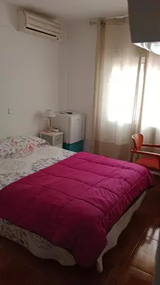 Cama o camas de una habitación en Hostal de la Angelita