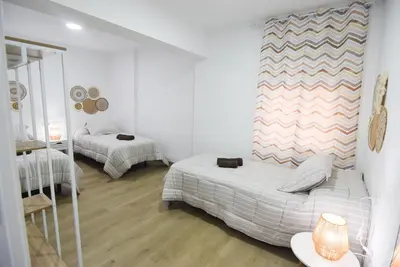 Cama o camas de una habitación en BAJO 23 con FACIL APARCAMIENTO