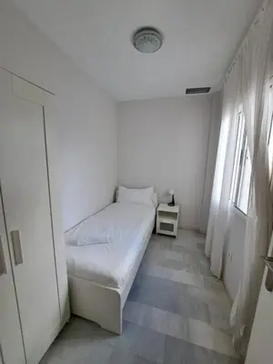 Cama o camas de una habitación en Selecta Apto con dos dormitorios en patio tradicional