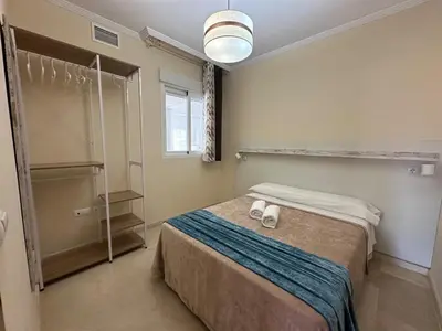 Cama o camas de una habitación en Piso en Linares zona Paseo con parking gratis