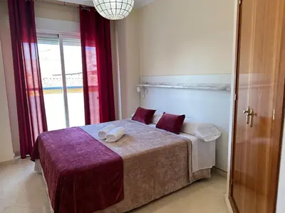 Cama o camas de una habitación en Piso en Linares zona Paseo con parking gratis