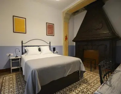 Cama o camas de una habitación en Hotel Casa de los Azulejos