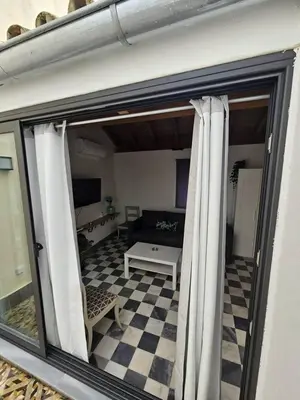 Una televisión o centro de entretenimiento en Dúplex con vistas a Las Setas