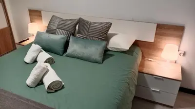 Cama o camas de una habitación en Apartamento parking y piscina incluido