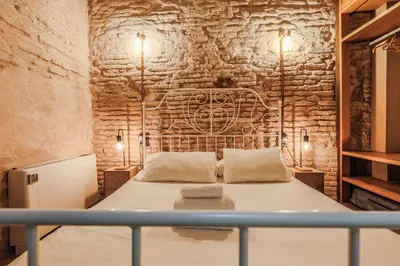 Cama o camas de una habitación en Encantador apartamento con patio en Macarena