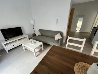 Una televisión o centro de entretenimiento en Apartamento La Placeta