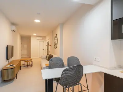 Una televisión o centro de entretenimiento en Green-Apartments Alameda
