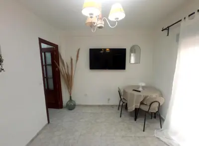 Una televisión o centro de entretenimiento en Apartamento HZ Califa