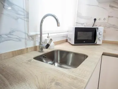 Una cocina o zona de cocina en BHost - Juan de Mena