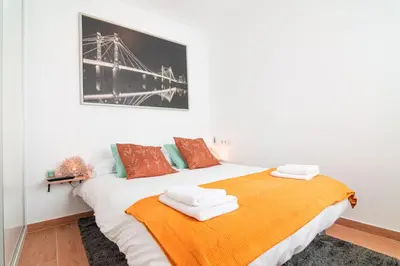 Cama o camas de una habitación en Edomus Ciudad Jardin