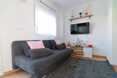 Una televisión o centro de entretenimiento en Edomus Ciudad Jardin