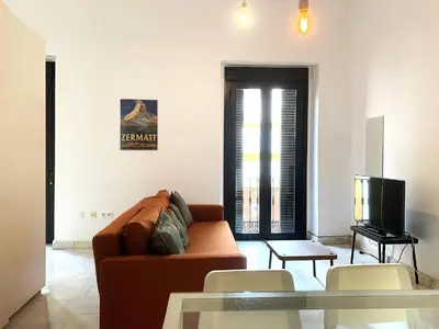 Una televisión o centro de entretenimiento en Apartamento Iglesia San Luis