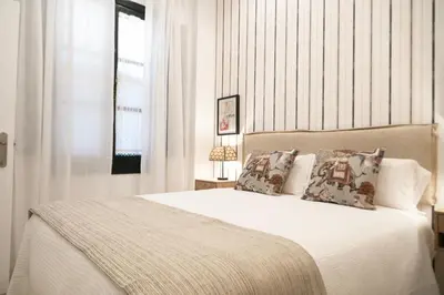 Cama o camas de una habitación en AvantiStays Guadalquivir