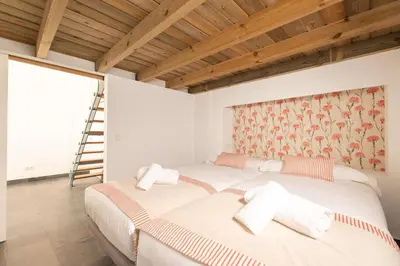 Cama o camas de una habitación en Puerta Osario Oasis by Valcambre