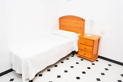 Cama o camas de una habitación en Piso turístico Aranda Paniagua