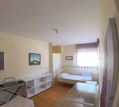 Cama o camas de una habitación en Mirasierra Ático