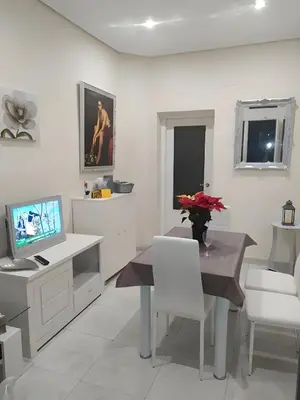 Una televisión o centro de entretenimiento en Room Boutique Don Antonio