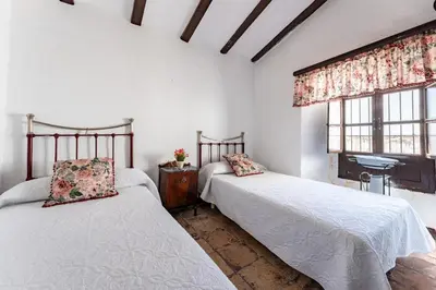 Cama o camas de una habitación en MalagaSuite Bobadilla Casa Rural
