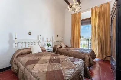 Cama o camas de una habitación en MalagaSuite Bobadilla Casa Rural