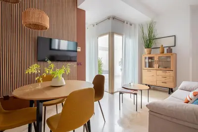 Una televisión o centro de entretenimiento en Magno Apartments Duque Cornejo