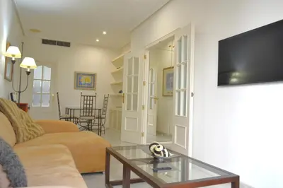 Una televisión o centro de entretenimiento en Sunshine Patio del Circulo