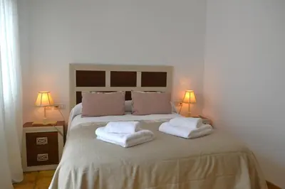 Cama o camas de una habitación en Sunshine Jardin de Orive