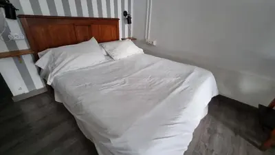 Cama o camas de una habitación en Loft en casco historico Macarena