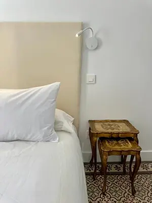 Cama o camas de una habitación en Unique Sevilla