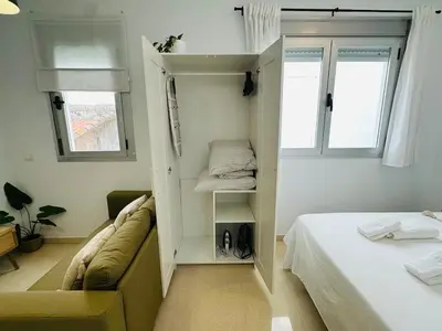 Cama o camas de una habitación en Apartamentos Macarena Centro Histórico