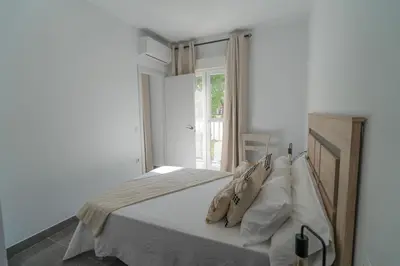 Cama o camas de una habitación en Apartamentos Áurea Casas del Sur