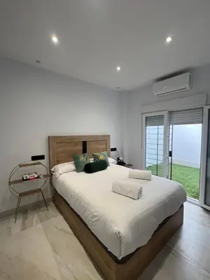 Cama o camas de una habitación en Únika Homes Nervión & Terrace