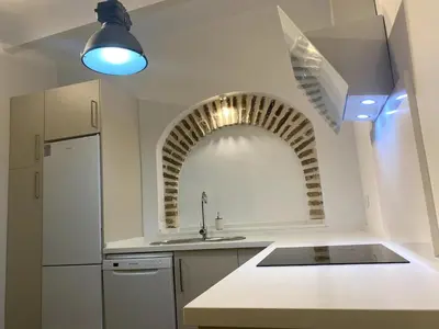 Una cocina o zona de cocina en Precioso apto cerca del Puente del Dragón
