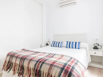 Cama o camas de una habitación en Precioso apto Sevilla zona Calle Feria