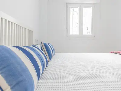 Cama o camas de una habitación en Precioso apto Sevilla zona Calle Feria