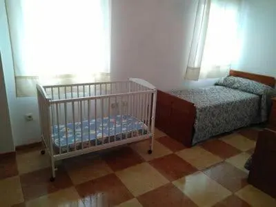 Cama o camas de una habitación en Piso Calle Pelayo