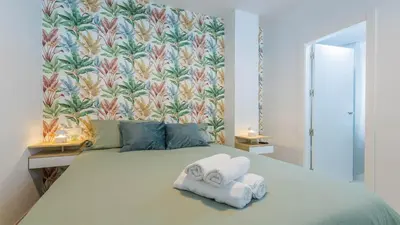 Cama o camas de una habitación en Apartamentos La Muralla de Córdoba
