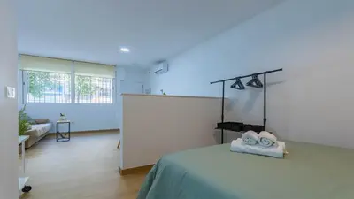 Cama o camas de una habitación en Apartamentos La Muralla de Córdoba