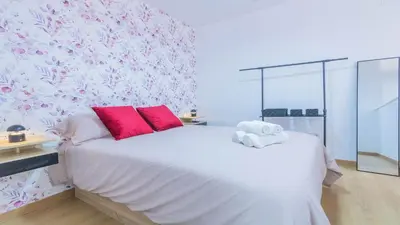 Cama o camas de una habitación en Apartamentos La Muralla de Córdoba