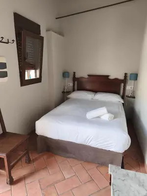 Cama o camas de una habitación en Hospedería Monasterio de San Leandro