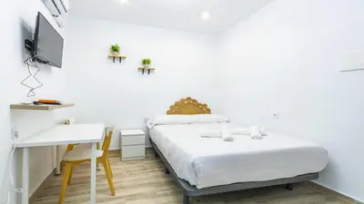 Cama o camas de una habitación en Estudios El Arcángel de Córdoba