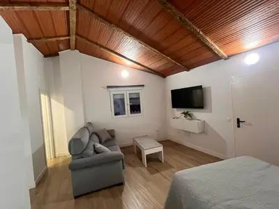 Una televisión o centro de entretenimiento en Apartamento Isabel