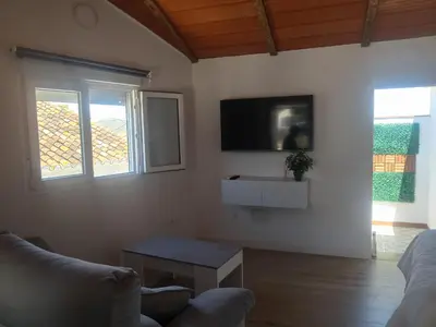 Una televisión o centro de entretenimiento en Apartamento Isabel