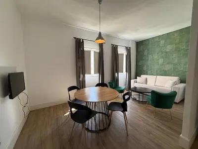 Una televisión o centro de entretenimiento en Ibarra Premium Apartment