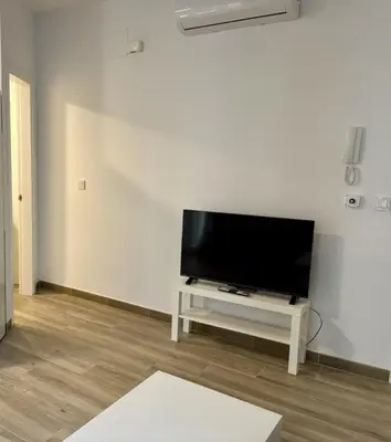 Una televisión o centro de entretenimiento en Ms22 Nuevo apartamento en centro