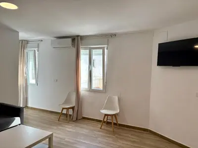 Una televisión o centro de entretenimiento en Ms31 Nuevo apartamento en centro